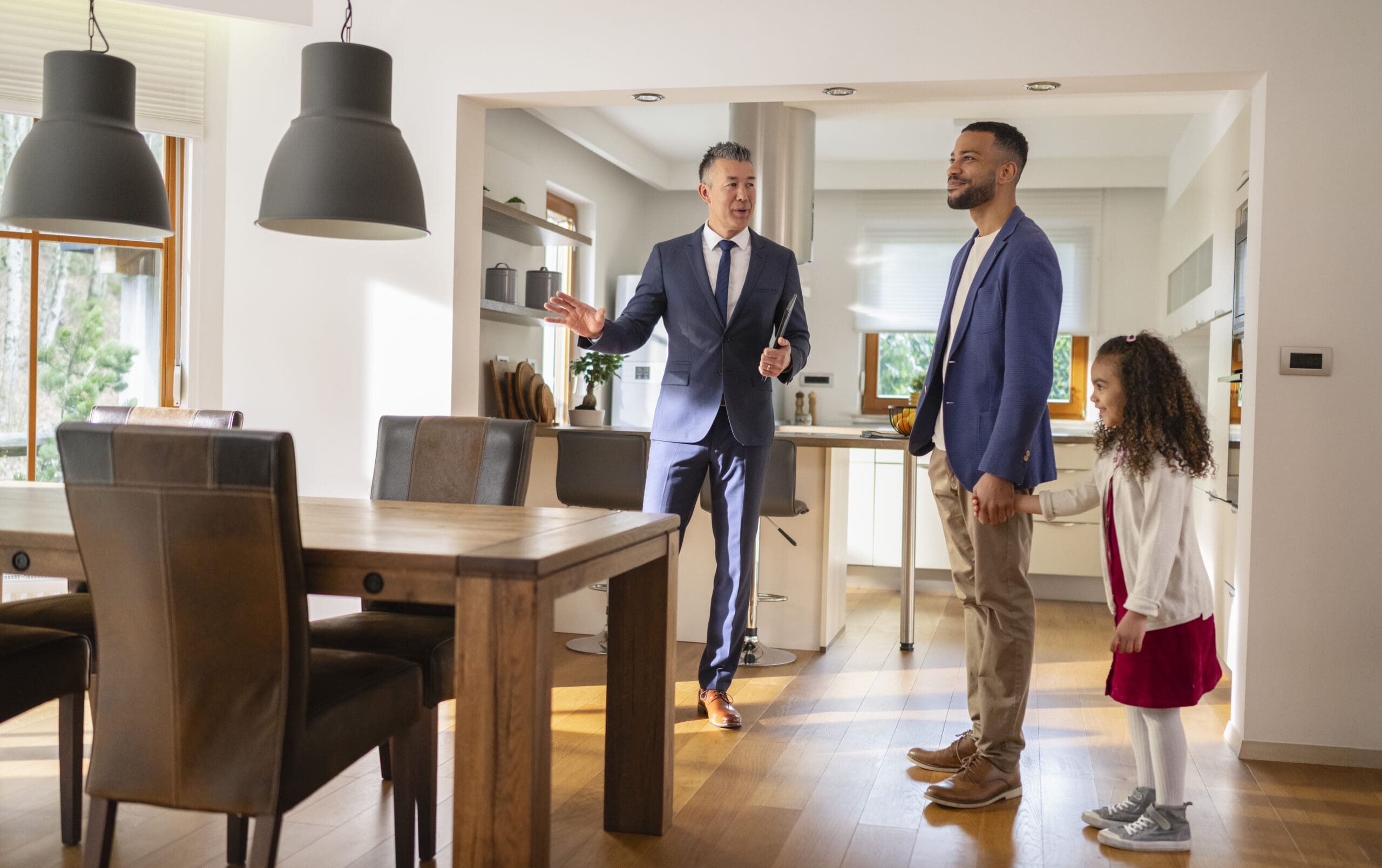A Real Estate Agent Showing House To A Single Father With Daughter